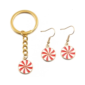 Christmas DIY set featuring red and white spiral candy charms with gold keychains and earrings