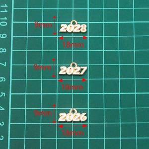 Golden alloy 2026-2028 year charms with white enamel for DIY jewelry making 9x18mm