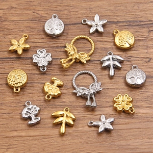 Divers pendentifs en acier inoxydable 304 doré avec arbre de vie et motifs floraux