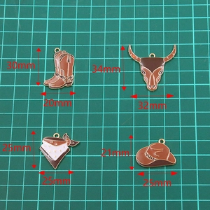 Set of Western cowboy charms featuring a boot, bull head, bandana, and hat for DIY jewelry
