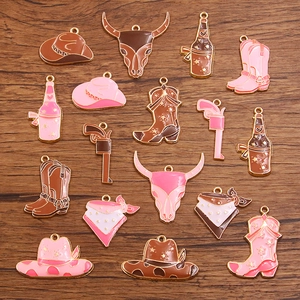 Detailed set of pink and brown cowboy charms including hats boots and bull skulls