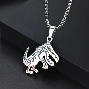 Detailed close-up of a silver dinosaur pendant necklace with colorful zigzag patterns