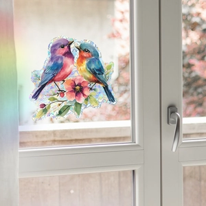 Rainbow holographic window sticker featuring two birds and pink flowers on glass