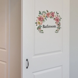 Floral Bathroom door sticker featuring pink roses and elegant typography on a white wood door
