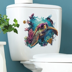 Waterproof sea turtle and coral bathroom decal applied to a white ceramic toilet tank