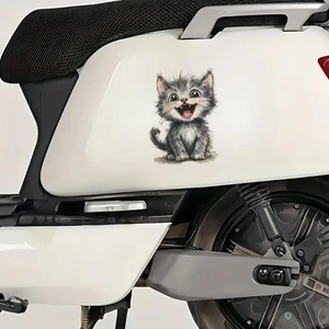 Funny laughing cartoon cat decal for motorcycles and scooters on a white surface