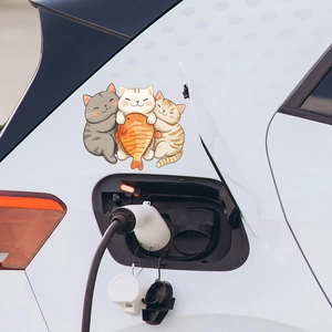 Three cute cartoon cats with fish waterproof car decal on white vehicle exterior