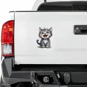 Cute cartoon laughing grey cat car sticker decal on a white pickup truck tailgate