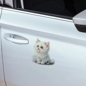 3D realistic white fluffy kitten car sticker with blue eyes on a white vehicle door