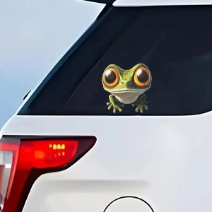 Funny green frog car sticker with big orange eyes on a white vehicle rear window