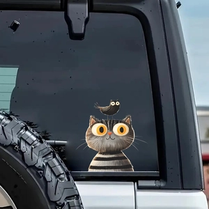 Cute cartoon gray cat and bird car window sticker on a white SUV rear window