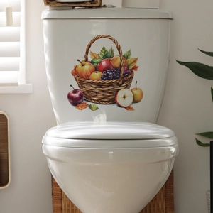 Vibrant fruit basket decal with grapes and apples on a white ceramic toilet tank