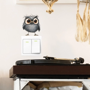 Cute gray owl wall sticker above light switch in cozy living room artistic decor