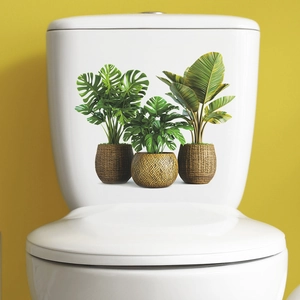 Tropical green plant potted stickers for bathroom decor on white toilet with yellow wall