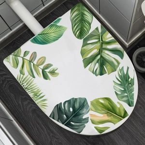 Tropical monstera leaf pattern toilet seat cover on a dark wood floor background