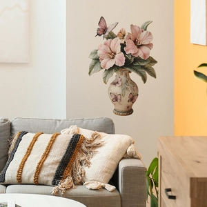 Detail view of a 3D floral vase wall sticker with pink flowers and butterflies in a room
