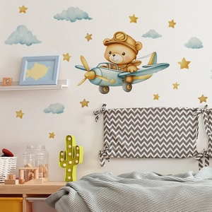 Cartoon bear pilot flying a blue airplane wall decal for children's bedroom decor