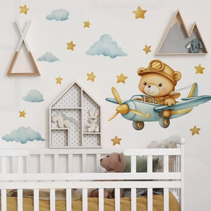 Cartoon bear flying plane wall decals with yellow stars and clouds for nursery decor
