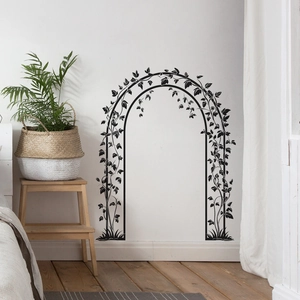 Black vine arch wall decal featuring leaves and plants for bedroom and living room decor
