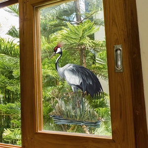 Self-adhesive glass window film featuring a realistic crane standing in lush greenery