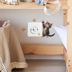 Cartoon kitten reaching for golden stars decorative light switch wall sticker for home