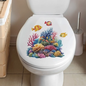 Detailed view of colorful coral and tropical fish decals on a white bathroom toilet lid