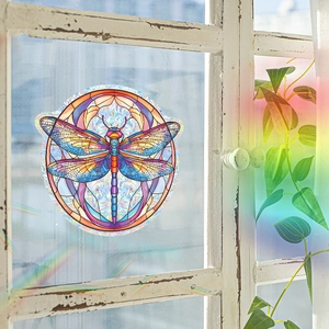 Colorful dragonfly window cling with laser diffraction rainbow effect on white wooden frame