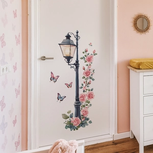 Black vintage street lamp wall sticker with pink roses and butterflies on a white door