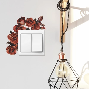 Vintage red rose wall stickers decorating a white light switch in a stylish living room