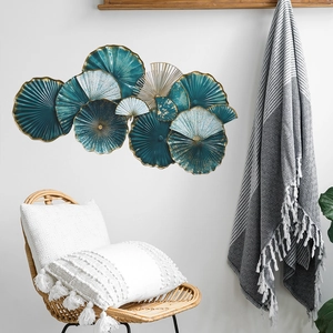 Modern luxury metal wall art featuring tiered fan-shaped elements in blue and gold colors