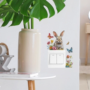 Cute bunny and floral wall sticker decoration around double light switch in a cozy room