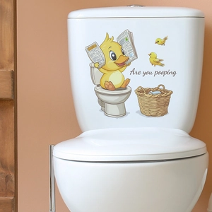 Sticker canard lisant un journal sur les toilettes pour décoration de salle de bain