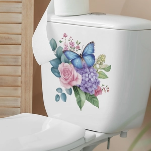 Watercolor rose and blue butterfly floral decal on white ceramic toilet tank wall