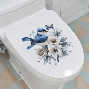 Vue détaillée d'autocollants oiseaux et fleurs sur un couvercle de toilette blanc décoré
