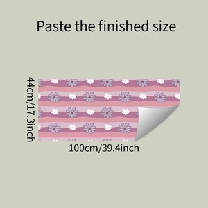 Detail of floral wall sticker with pink daisy patterns showing dimensions 100x44cm and adhesive back