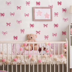 Pink cartoon bow wall stickers with checkered patterns for nursery and girls' room decor