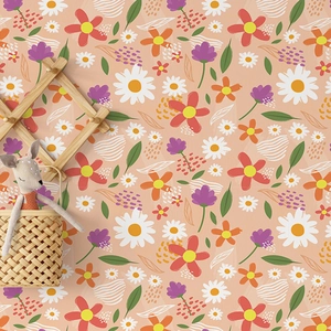 Sticker mural floral avec marguerites et feuilles vertes pour chambre sur fond orange chaleureux