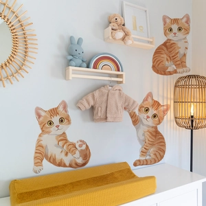 Three cute orange cartoon cat wall stickers in sitting and sleeping poses for nurseries