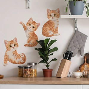 Cartoon ginger cat wall stickers set featuring three cute poses for home wall decoration