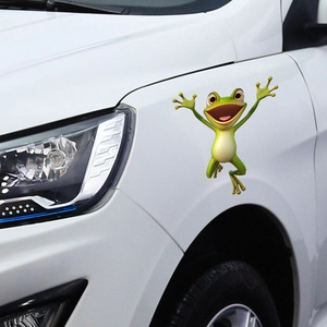 3D cartoon green frog car sticker showing a joyful jumping pose on white vehicle surface