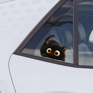 3D cartoon black cat car sticker with large orange eyes on a white vehicle window