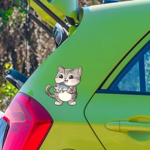Cute cartoon grey striped cat holding a fish sticker on a green car body surface