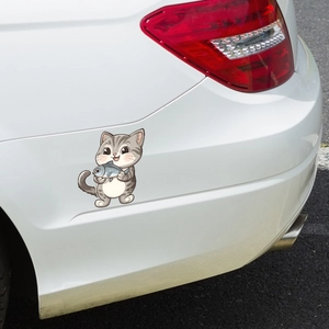 Cute cartoon grey striped cat holding a blue fish car sticker on rear bumper