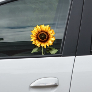 Vibrant sunflower car window sticker with bright yellow petals on a sleek white vehicle