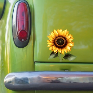Waterproof sunflower car sticker with golden petals on a vintage vehicle rear
