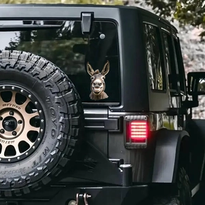 Funny donkey head window decal on black SUV rear glass with realistic vinyl texture