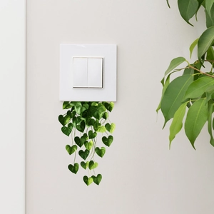 Green hanging vine wall sticker for bedroom decor around light switches and sockets