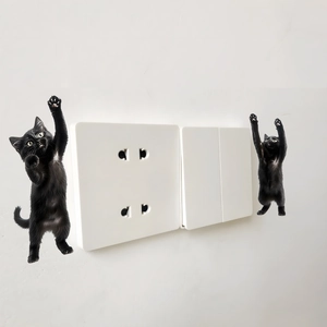 Minimalist black cat wall stickers featuring two funny kittens climbing on a wall switch