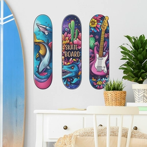 Three-piece skateboard wall art set with vibrant ocean, dinosaur, and guitar illustrations
