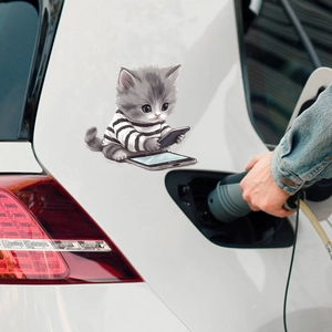 Cartoon grey cat sticker on white car body showing the kitty holding a smartphone
